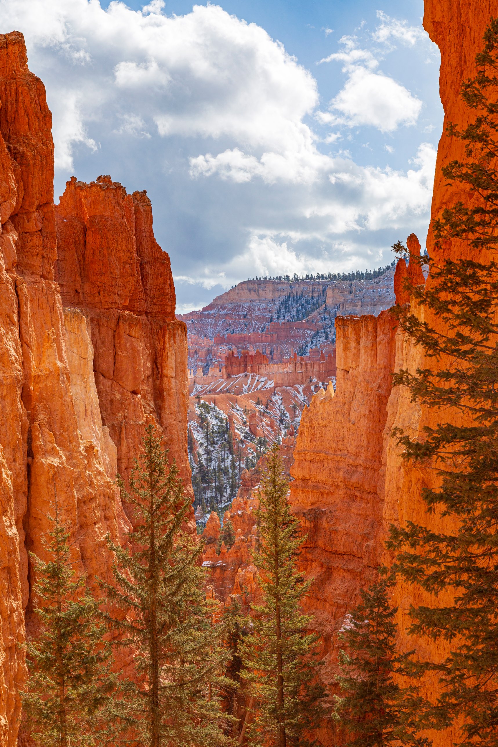 Wide panoramic view of Bryce Canyon amphitheater with snow